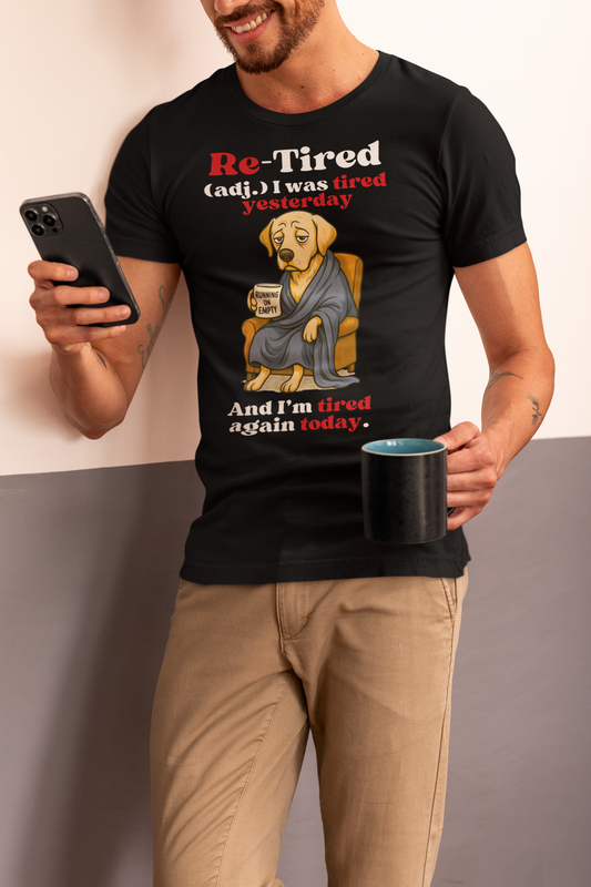 Smiling man wearing a black “Re-Tired” t-shirt featuring a tired cartoon dog holding a coffee mug that says “Running on Empty,” with the caption “I was tired yesterday and I’m tired again today.” Perfect Father’s Day gift for dog dads, tired dads, or retired men.